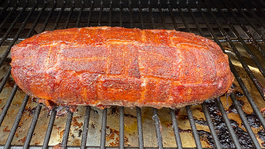 Bacon and Sausage Breakfast Fatty Stuffed with Eggs, Potatoes, and Cheese